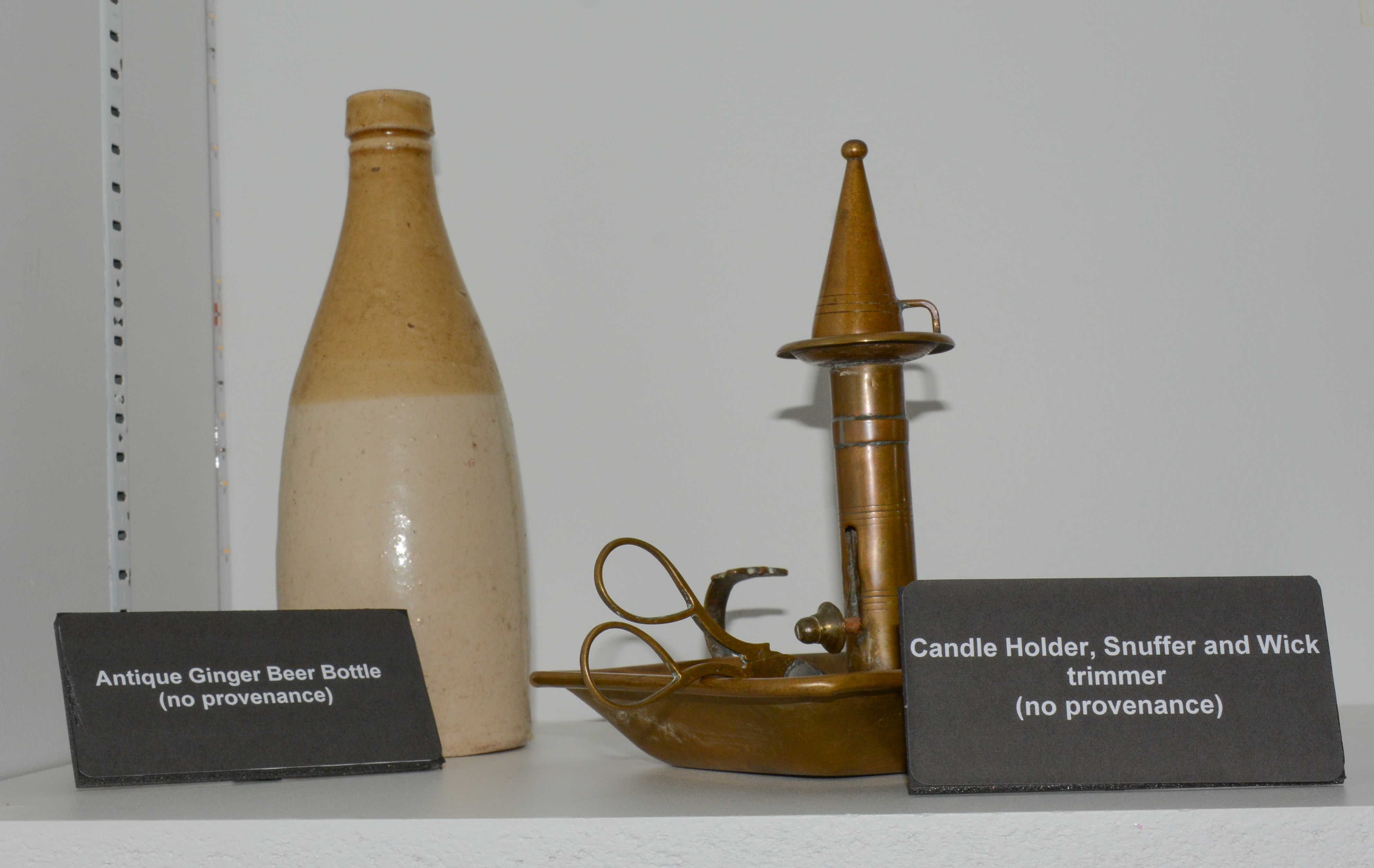 Antique Ginger Beer Bottle(left) and Candle Holder, Snuffer, and Wick trimmer(right)