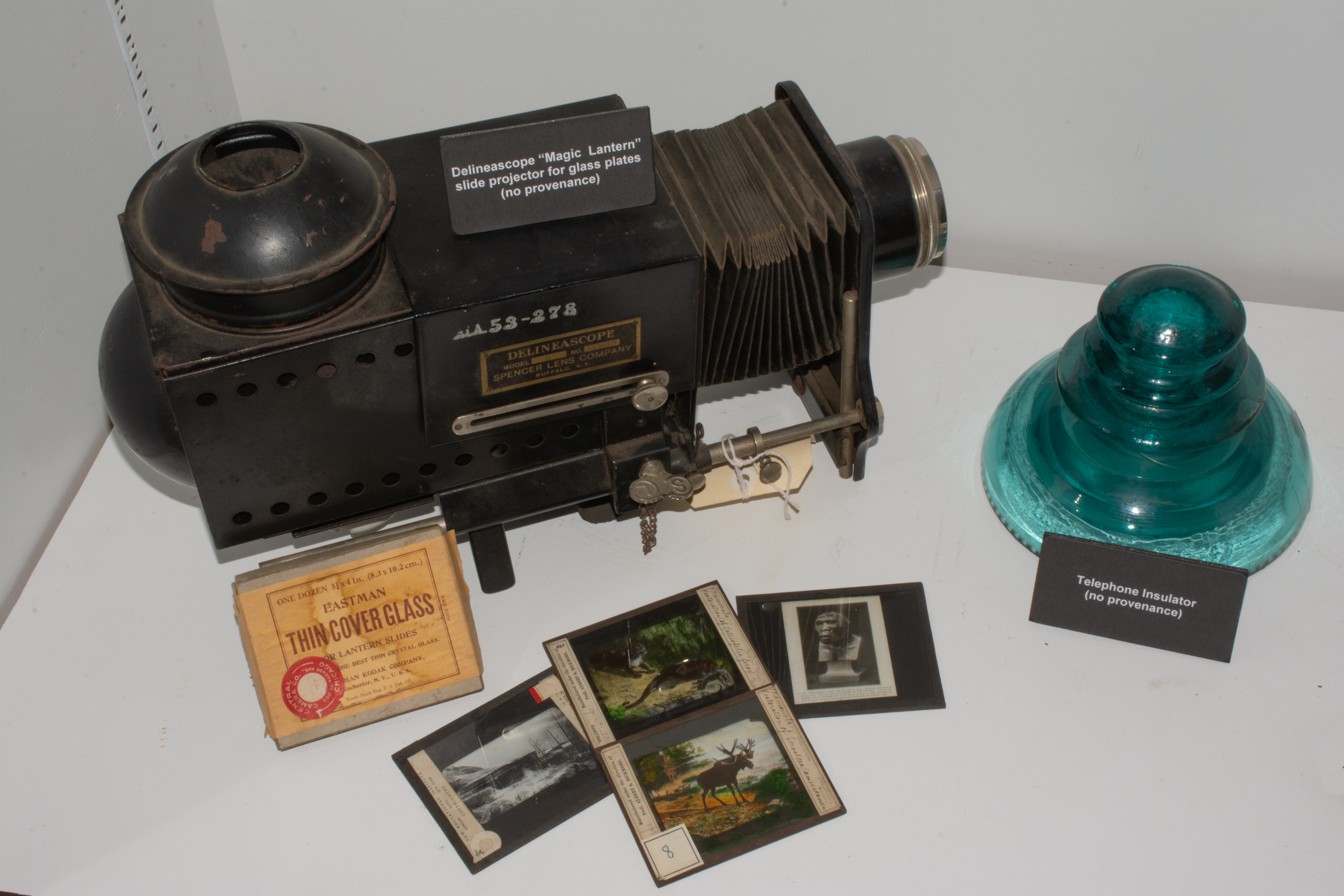 Delineascope 'Magic Lantern' slide projector for glass plates(left) and Telephone insulator(right)